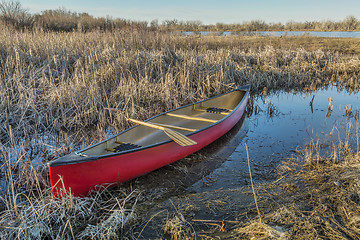 Image showing red canoe in a wetland