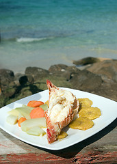 Image showing fresh Caribbean lobster tails cooked garlic and butter with loca