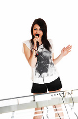 Image showing Girl singing with keyboard.