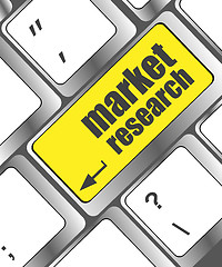 Image showing key with market research text on laptop keyboard, business concept