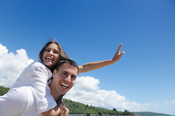 Image showing happy couple have fun on the beach