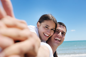 Image showing happy couple have fun on the beach