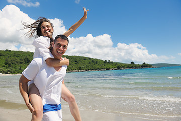 Image showing happy couple have fun on the beach