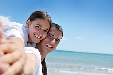 Image showing happy couple have fun on the beach