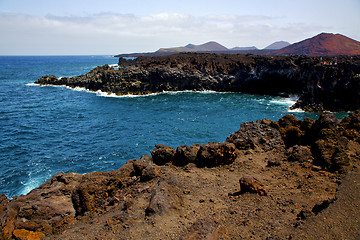 Image showing people   coastline stone volcanic spain  water  in lanzarote   