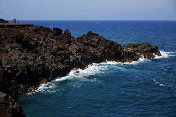 Image showing people stone volcanic spain  water coast in lanzarote   