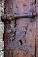 Image showing castle lock spain knocker   abstract door wood in the red brown 