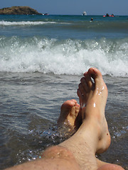 Image showing my legs in blue sea 