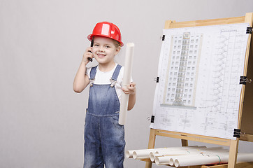 Image showing Child drawing at Board, talking on phone