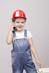Image showing child Builder talking on the phone