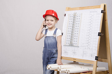 Image showing Child Builder talking on the phone