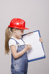 Image showing Child engineer shows in a sheet of paper