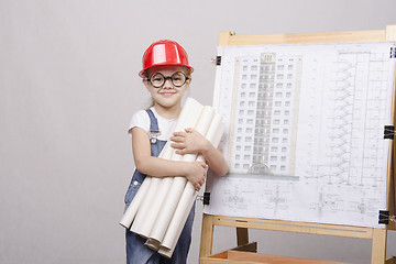 Image showing child with glasses costs drawings at Board