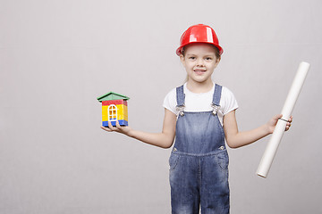 Image showing Girl Builder keeps house and drawing