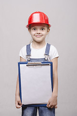 Image showing child in helmet advertises inscription on sheet