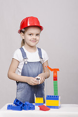 Image showing The girl helmet plays in constructor