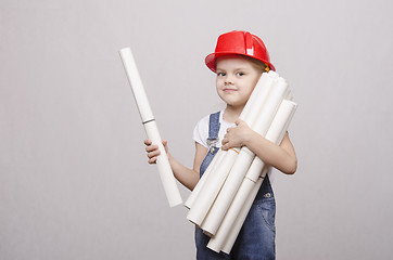 Image showing Child architect holds a lot of drawings