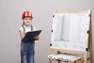 Image showing Girl architect is drawing near