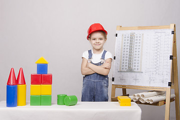 Image showing Child Builder builds a house on the drawing