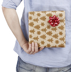 Image showing Young man holding a present