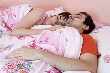Image showing Young couple sleeping together.
