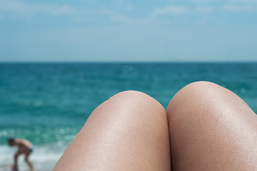 Image showing Legs on the beach