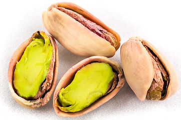 Image showing A stack of roasted pistachios on white 