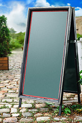 Image showing Chalkboard stand outside the restaurant