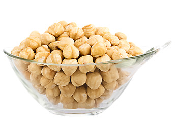 Image showing hazelnuts in glass piala. Isolation on white background