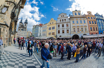 Image showing Tourists walk around the Old Town Square in Prague waiting for s