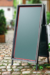 Image showing Chalkboard stand outside the restaurant