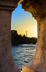 Image showing View of the Eiffel Tower through the construction of a bridge