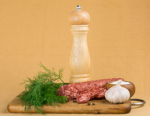 Image showing Simple still life with cut sausage