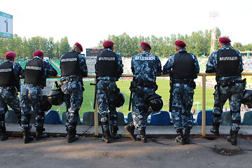 Image showing policemen standing guard over order in the stadium