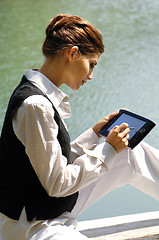 Image showing business woman with laptop at the sea