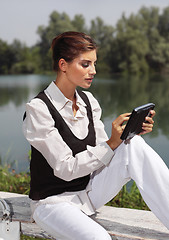 Image showing a woman with laptop in park cvb