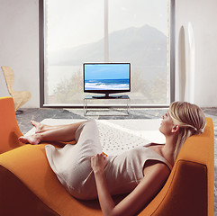 Image showing woman relaxing and watching TV