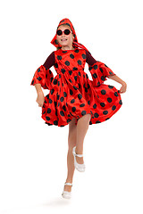 Image showing teen girl dancing in a red polka-dot dress with sunglasses