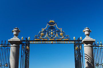 Image showing The gate and fence on a blue sky background