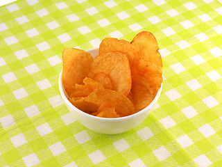 Image showing Potato chips falling in the white plate