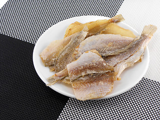 Image showing Dried fishes on white plate