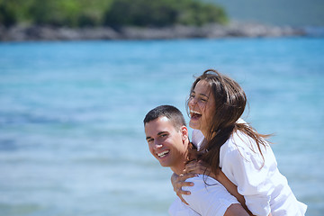 Image showing happy couple have fun on the beach