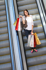 Image showing Happy young woman in a shopping mall