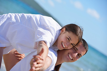 Image showing happy couple have fun on the beach