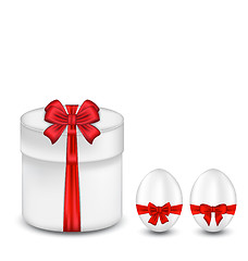 Image showing Easter gift box with red bow and eggs