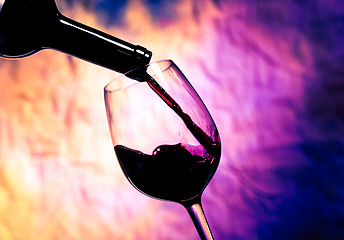 Image showing Red Wine Poured into Wineglass