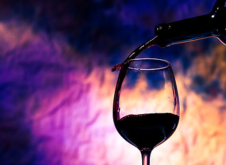 Image showing Red Wine Poured into Wineglass