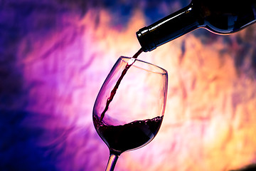 Image showing Red Wine Poured into Wineglass