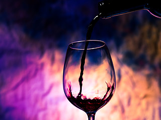 Image showing Red Wine Poured into Wineglass