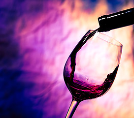 Image showing Red Wine Poured into Wineglass